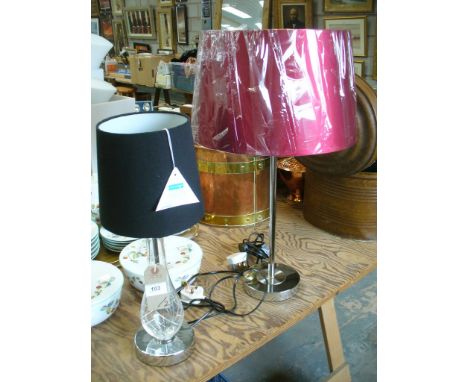 A Modern glass bottle shaped table lamp and a second chromed column table lamp c/w shades ( 655 OC , 655 O )

*Please note th