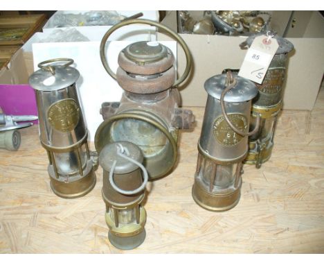 An Early 20th Century  " Griffiths & Sons " carbide road lamp, a " Protector lamp and lIghting Co Ltd " miners lamp, a second