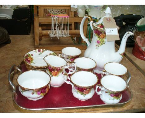 A Royal Albert " Old country roses" coffee service comprising coffee pot, milk jug , sugar bowl, 5 cups and 6 saucers.