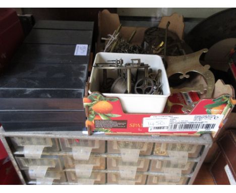 Two multi drawer table cabinets containing a quantity of clock related spares, parts, hinges, bolts, chains etc, a small box 
