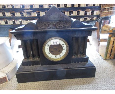 19th Century black slate and gilt metal mounted mantel clock, the architectural case with enamel dial and Arabic numerals fla