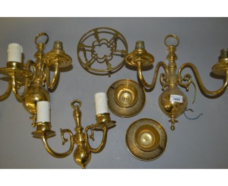 Pair of brass two branch wall lights, similar smaller two branch wall light, two brass teacups with saucers and a brass trivi