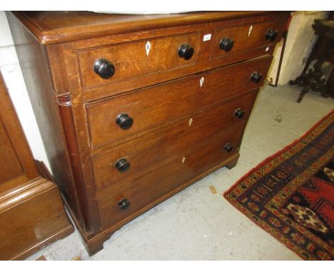 19th Century North country oak straight front chest of two short and three long drawers with knob handles and ivory escutcheo