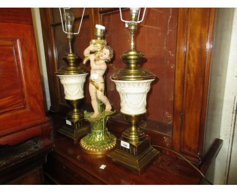 Pair of reproduction cream glazed pottery and brass mounted table lamps together with a gilded and painted composition figura