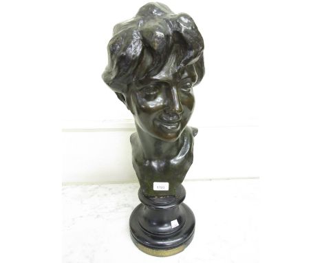 Jules Herbays patinated bronze bust of a young woman, signed in the bronze and mounted on a circular ebonised base, 22ins hig