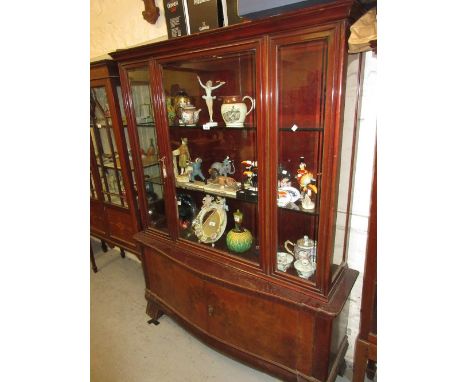 Mid 20th Century Continental stained wood and burr walnut display cabinet, the central bevelled glass door flanked by further