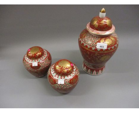 Modern Chinese baluster form vase and cover decorated in iron red, green and gilt, together with a pair of matching ginger ja