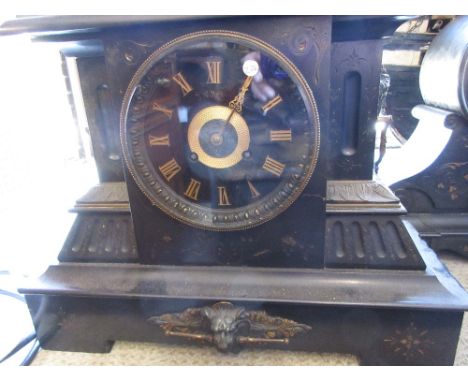 Large 19th Century black slate mantel clock, the black dial with gilt Roman numerals the case  with mask head appliques and s