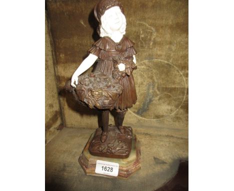 Reproduction bronze and ivorine figure of a girl carrying a basket of flowers after Chiparus, 10.5ins high 