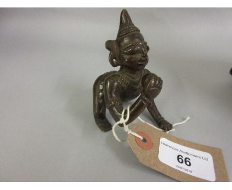 Small Eastern bronze figure of a crawling child with ball 