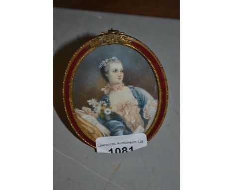 Oval framed miniature portrait of a seated lady, housed in a gilt metal frame 
