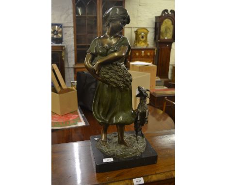 20th Century patinated bronze figure of a lady in green dress holding a crop with a goat at her feet on a marble plinth base,