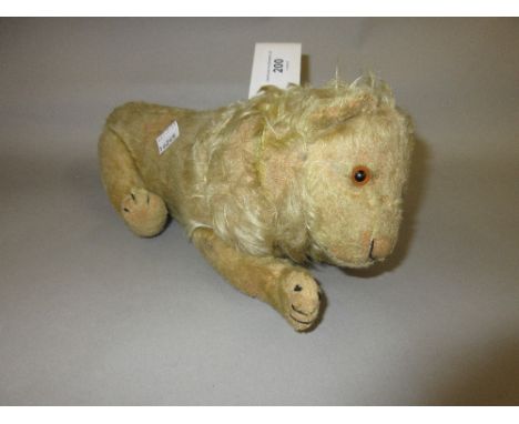 Early 20th Century Steiff yellow mohair covered figure of a standing lion with swivel head and articulated limbs, glass eyes 