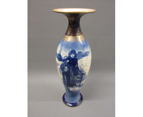 Large Royal Doulton Blue Children baluster form vase decorated with a figure in a winter landscape, 16.5ins highSome crazing 