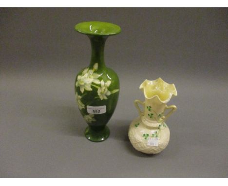 Doulton Lambeth baluster form pottery vase decorated with daffodils, together with a Belleek two handled porcelain vase 