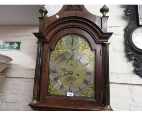 George III mahogany longcase clock, the arched hood with fretwork pediment above tapering columns and an arched door on a pli