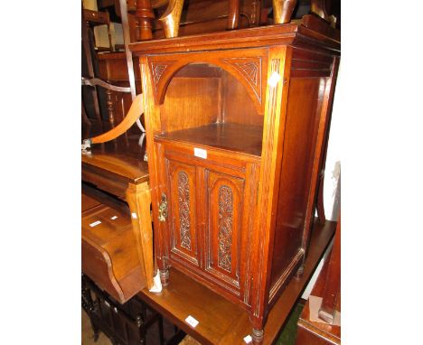 Late Victorian walnut bedside cabinet with an alcove above carved panelled door 