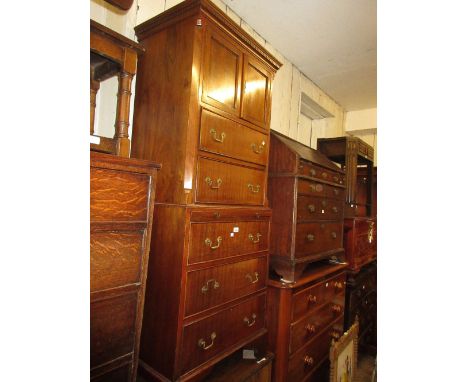 Small 20th Century mahogany tallboy with a moulded dentil cornice above two doors, brushing slide and five drawers with brass