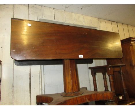 Early Victorian mahogany rectangular drop-leaf breakfast table on an octagonal column support and quadruped platform base 