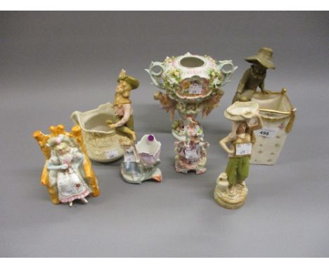 Austrian rectangular pottery vase with a gilt figure of a boy seated on the rim together with another similar figural vase, a