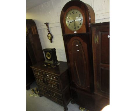 Early 20th Century mahogany longcase clock with an oval bevelled glass door, the circular silvered dial with Arabic numerals,