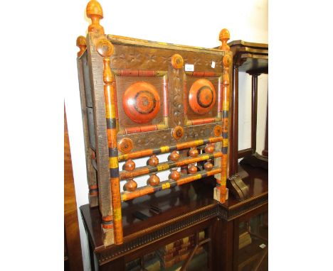 Eastern European low storage trunk with hinged cover and panelled spindle front with painted decoration 21in high x 22in wide