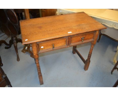 Early 20th Century oak two drawer side table together with a pair of Victorian bedroom chairs with shaped backs and cane seat