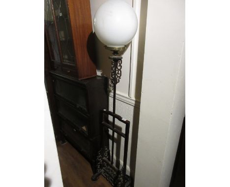 Chinese hardwood standard lamp with opaque glass ball form shade with carved and pierced Oriental style decoration (at fault)