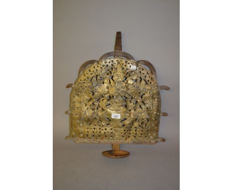 Antique pierced and repousse decorated brass and steel lamp bracket with oil tray decorated with stylised birds and foliage, 