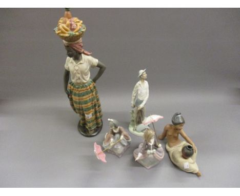 Nao matt glazed figure of a West Indian girl carrying a basket of fruit, a Lladro figure of Don Quixote, a Lladro matt glazed