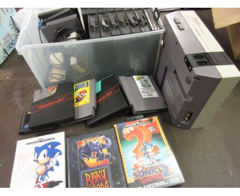 Nintendo NES games console together with a quantity of games and a quantity of Sega games 