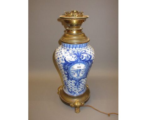 Continental pottery metal mounted table lamp decorated in blue and white 