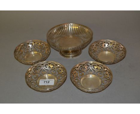 Birmingham silver circular pedestal bonbon dish and a set of four Birmingham silver pierced trinket dishes by Mappin & Webb 