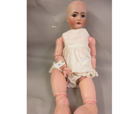 Large Simon Halbig bisque headed doll (body restored), 33ins highThere is restoration to right hand eye socket as you look at