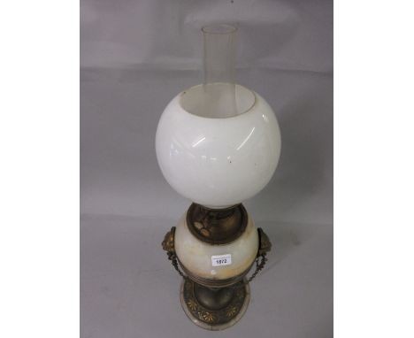 Late 19th/early 20th Century gilt metal and marble oil lamp the well mounted with lions head and chain swags with opaque glas