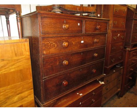 19th Century oak straight front chest of two short and three long drawers with knob handles raised on bracket feet 