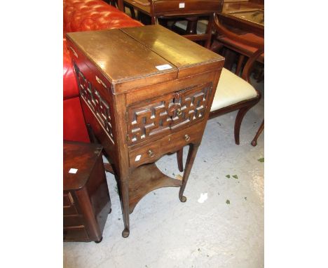 George III square mahogany washstand with a double hinged top enclosing brass basin etc (of later date) above two small doors