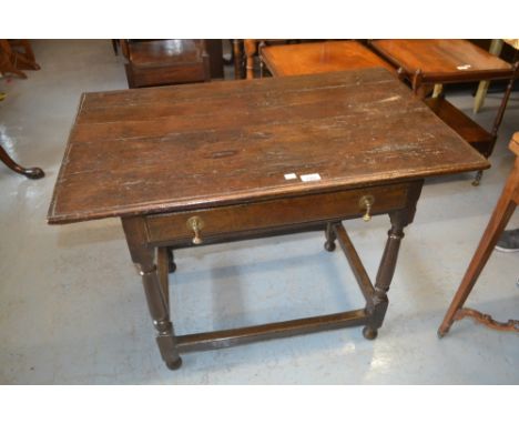 18th Century oak side table with a moulded plank top above a single frieze drawer raised on turned supports with stretchers 