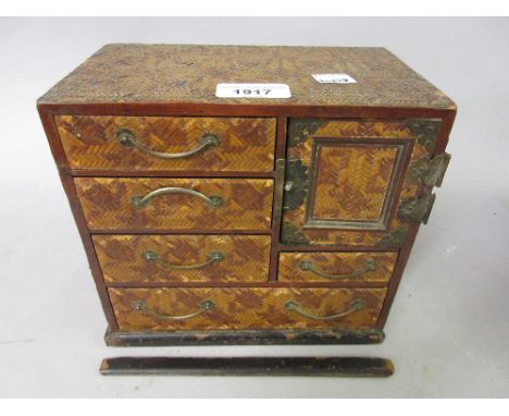 Small Japanese bamboo covered table cabinet with a single door and multiple drawers together with a pair of Chinese circular 