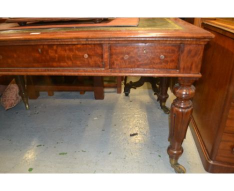 Victorian mahogany library table, the green tooled leather inset top above three frieze drawers raised on turned carved taper