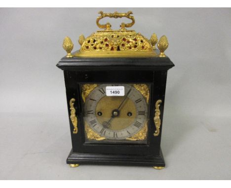 Small 18th Century ebonised and gilt brass table or bracket clock, the gilt basket top and acorn finials above a moulded case