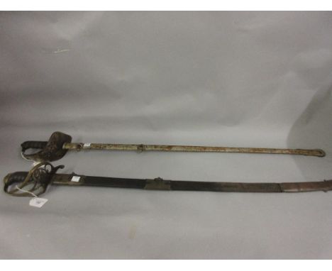 George IV sword with brass hilt and shark skin wire twist grip with leather and brass scabbard (at fault), and another sword 