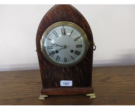 Edwardian oak and chequer inlaid lancet shaped mantel clock with a silvered dial, Roman numerals and two train movement 