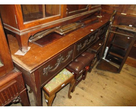 George III mahogany side table in Adam style, the moulded top above three frieze drawers relief moulded with swags raised on 
