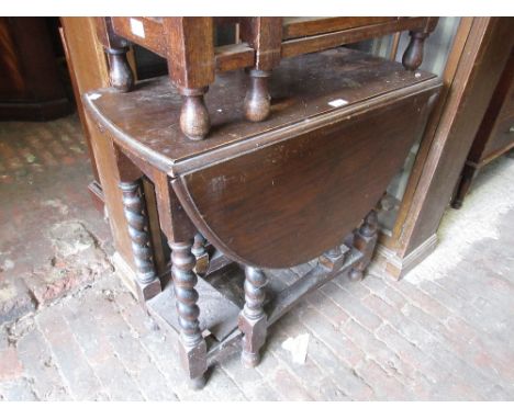 1930's Oak gate leg table on barley twist supports together with a 1930's oak fender stool and an Edwardian inlaid octagonal 