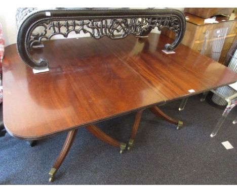 Reproduction mahogany twin pillared D-end dining table with single extra leaf raised on turned column and quadruped support 