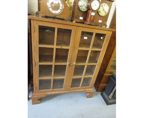 Pair of Arts and Crafts oak two door glazed bookcases on bracket feet44ins wide x 36ins high x 11ins deep each 