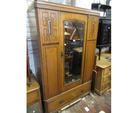 1930's Oak bedroom suite comprising: a single door wardrobe, dressing chest and bedroom chest 