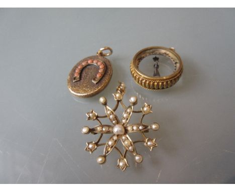 Unmarked yellow metal and split pearl star form pendant (at fault), together with a yellow metal and coral set locket decorat