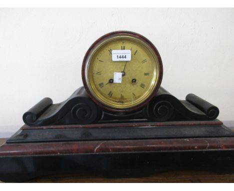 19th Century black slate and rouge marble drum form mantle clock, the engraved gilt metal dial with Roman numerals, the two t